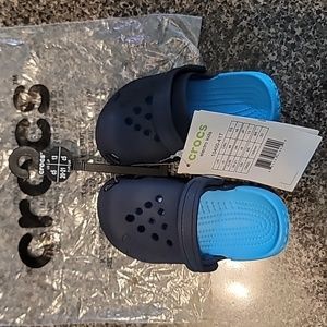 Never worn Navy & Electric Blue Roomy Fit Crocs